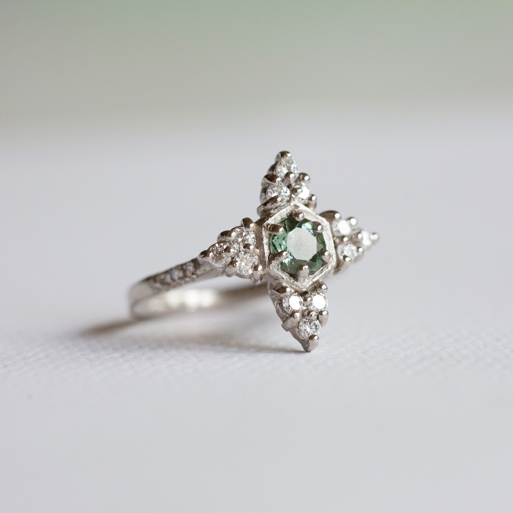 Bespoke green tourmaline and diamond engagement ring