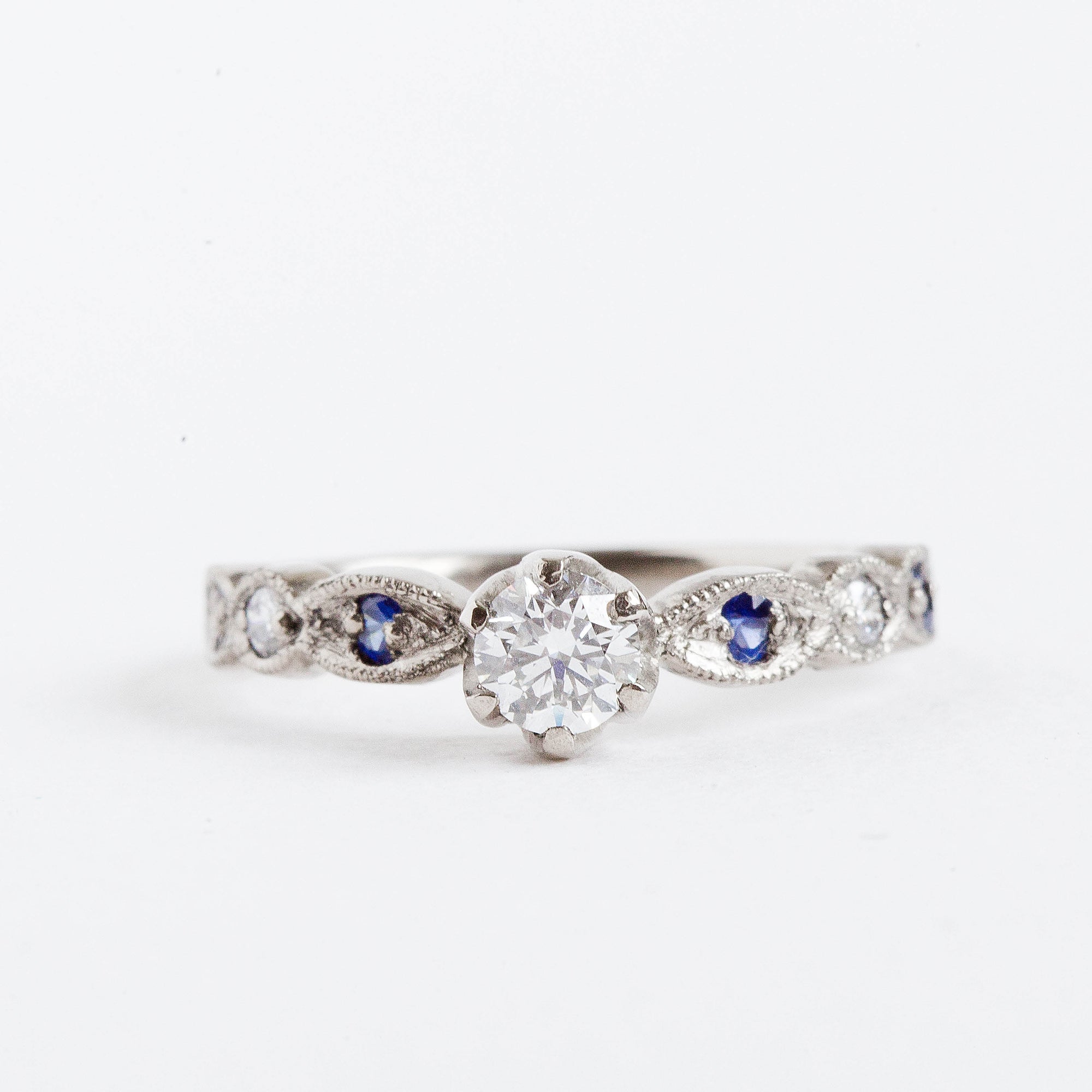 Custom diamond and blue sapphire engagement ring
